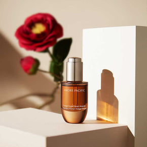 Vintage Single Extract Ampoule with Camellia flower background
